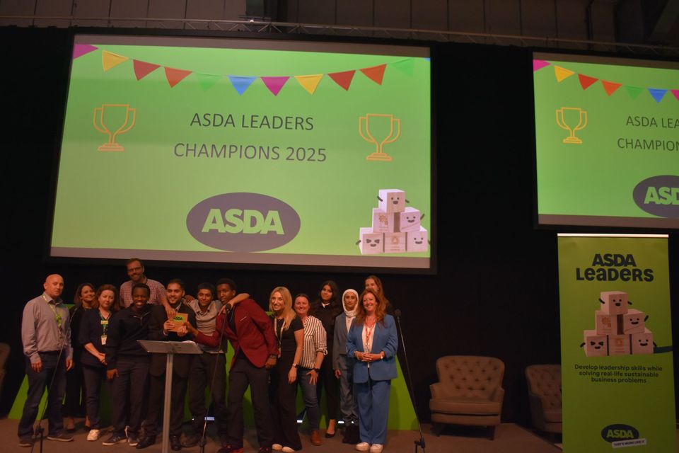 Image of winning student group on stage at event