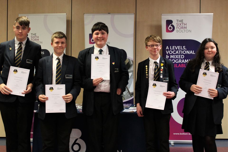 Group of school students with certificates