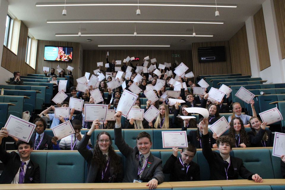 Group of school students with certificates