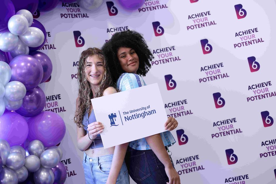 Image of two students on results day