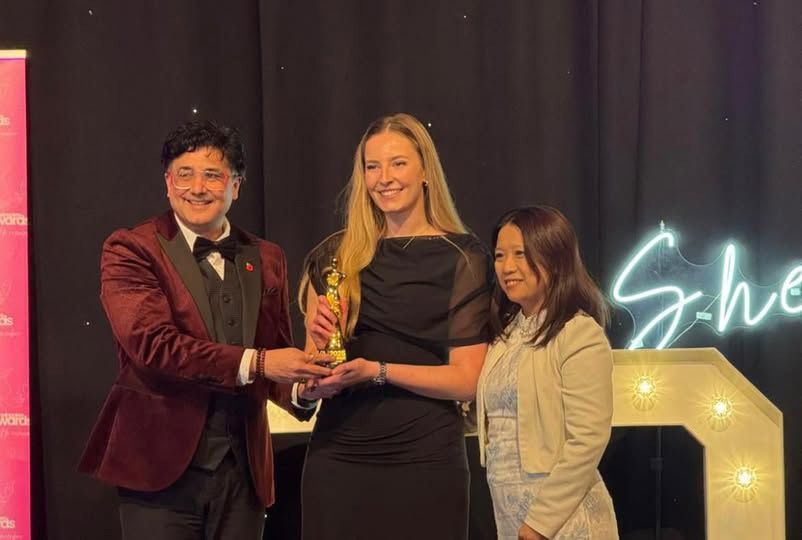 Image of 2 judges and 1 award winner